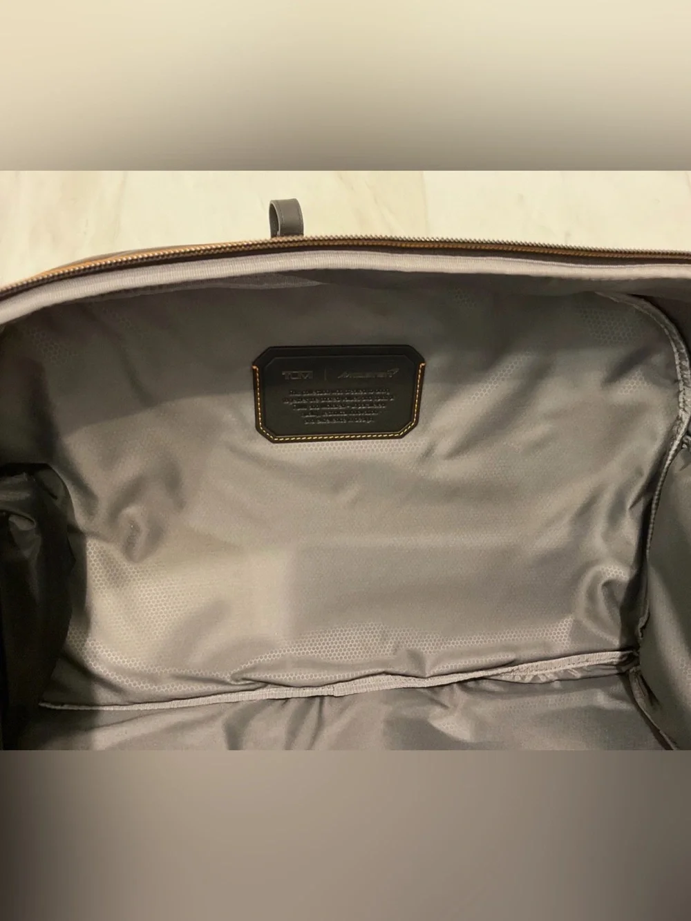 NEW Tumi McLaren QUANTUM 21.5” Duffel Bag - BLACK with PAPAYA ORANGE Accents